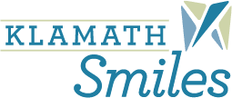 Klamath Smiles Klamath Falls Dentist logo. Words Klamath and Smiles with a tooth in the top right corner.